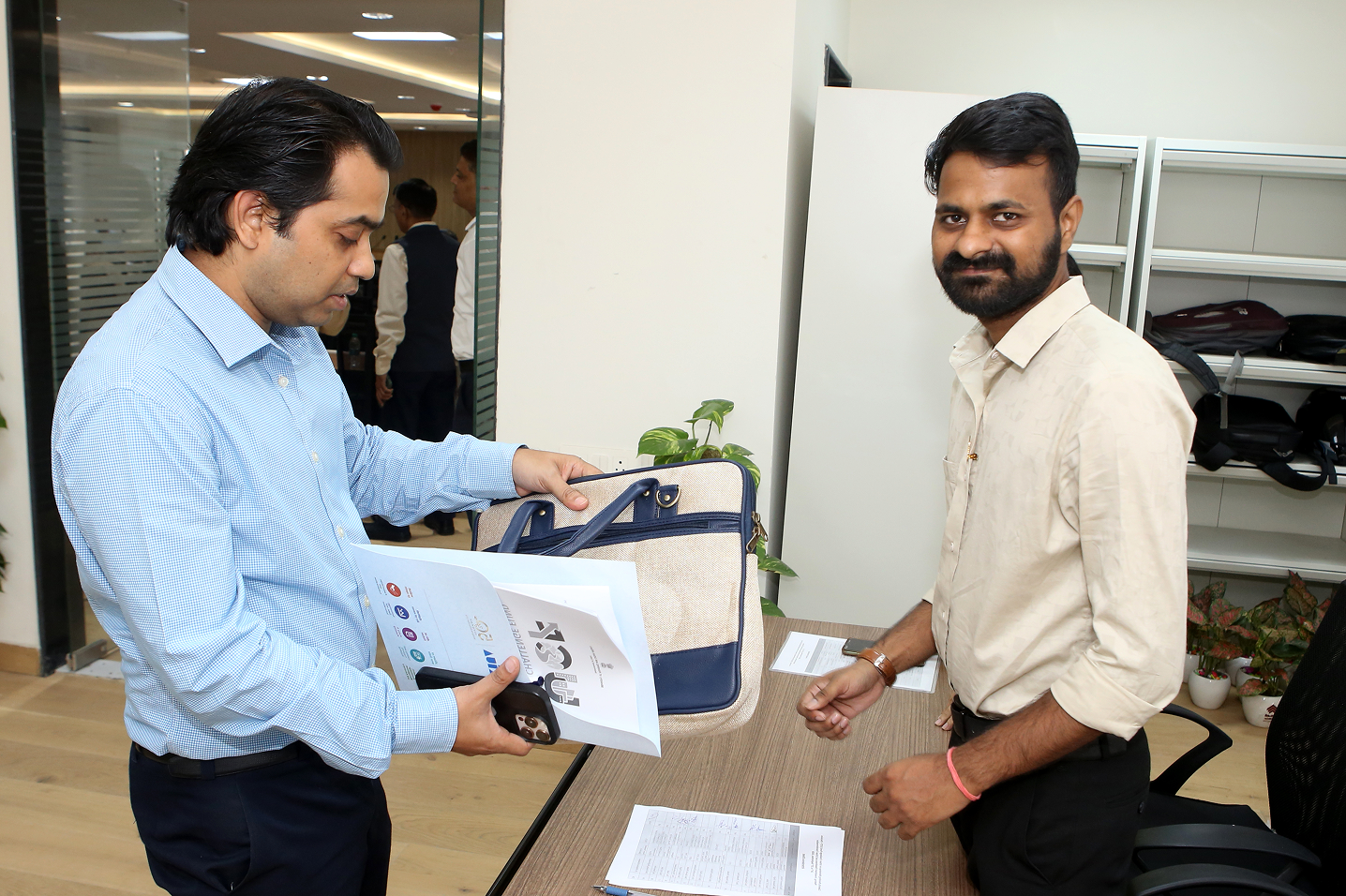 Colleagues exchanging workshop materials